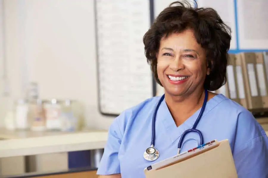 Nurse Holding a File and smiling
