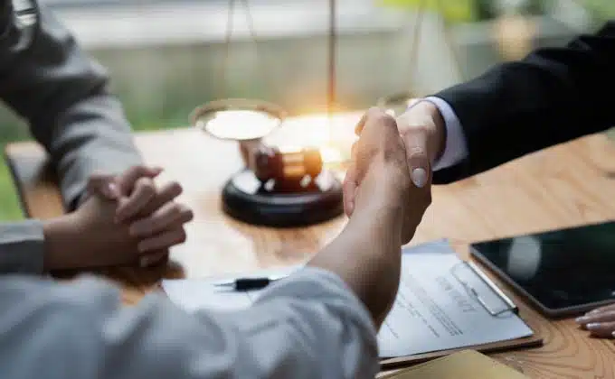 lawyer satisfied client handshake
