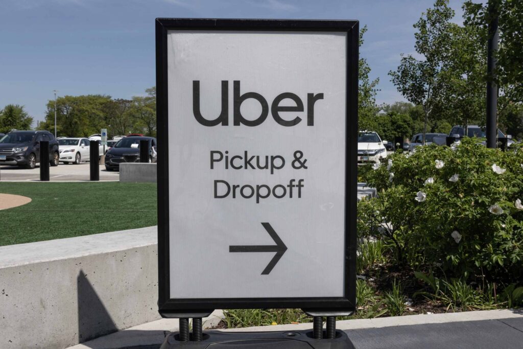 An Uber pickup and dropoff sign representing cases handled by Royal Palm Beach rideshare accident lawyers.