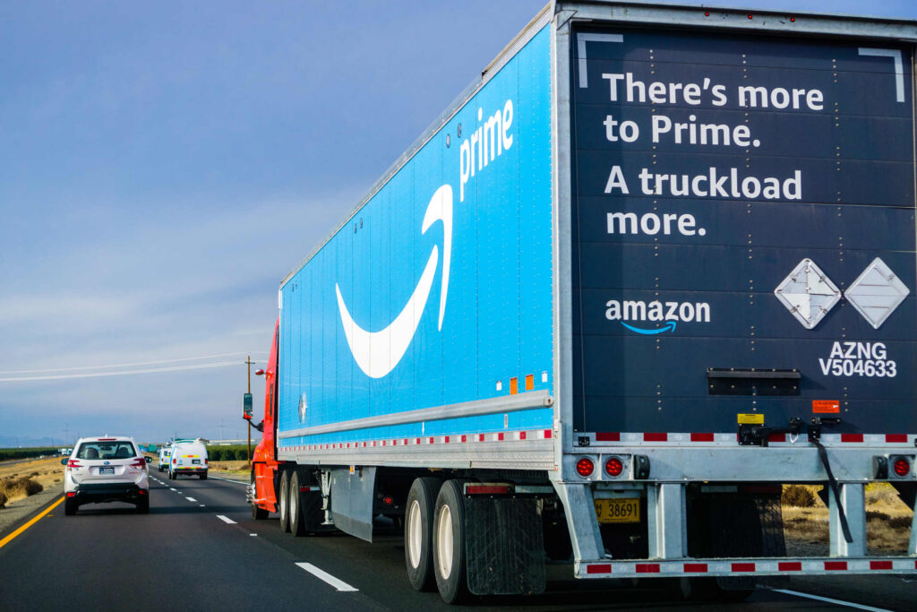 Blue Amazon Prime semi truck driving on a highway regarding an Amazon delivery accident lawsuit in Florida what you need to know.